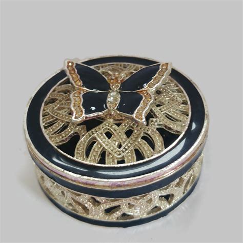 small metal antique pill box with coat of arms|old fashioned pill box.